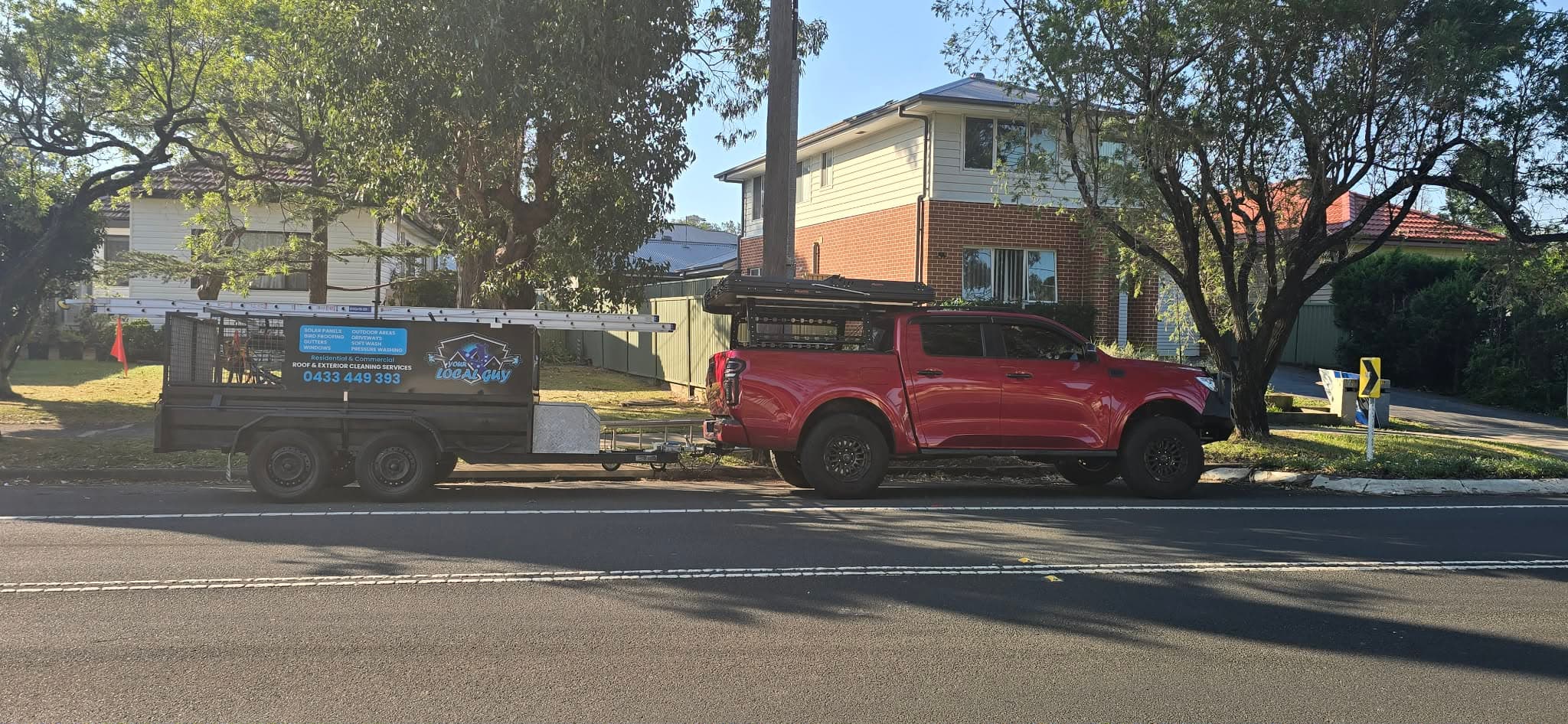 The Your Local Guy ute and signwritten service trailer parked on a south-Sydney street